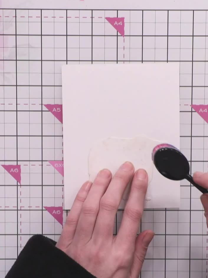 Step 3: Select a Distress Ink pad in a stormy blue shade and pick up a blending brush to prepare for inking.