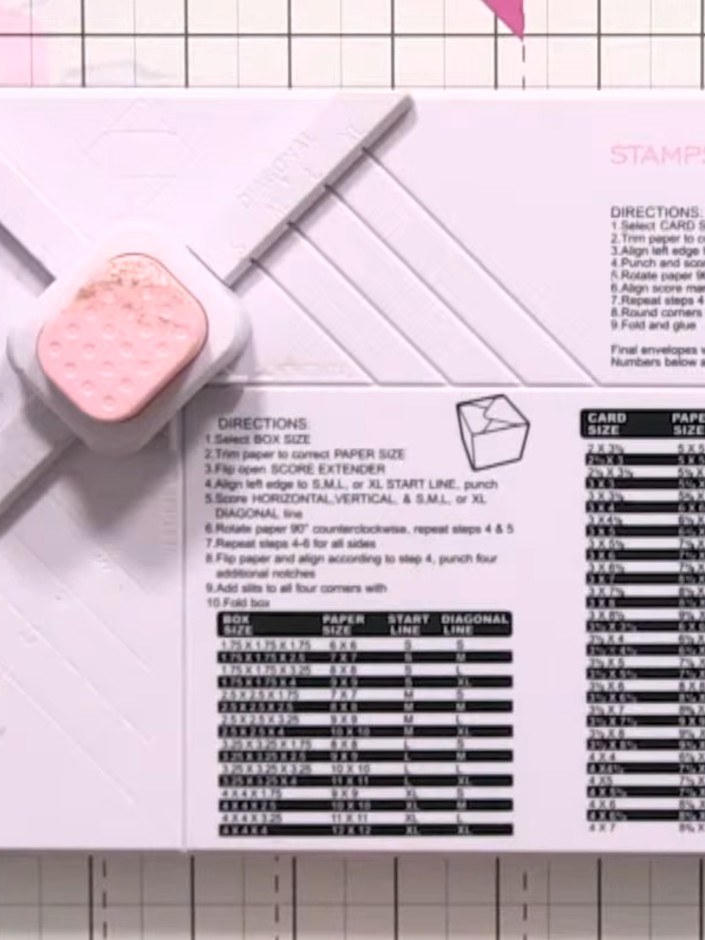 Step 2: Position your 12 x 12 inch card stock on the envelope maker board, aligning it with the XL score lines at the 