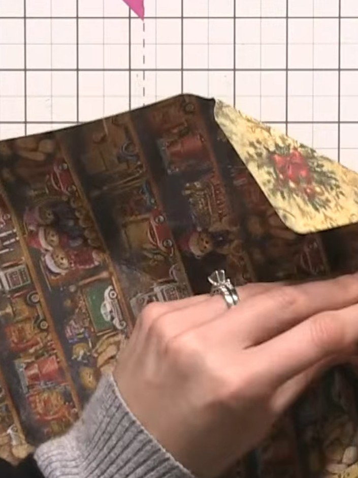 Step 8: Fold up the sides of the box to form the structure. Engage the hook and eye closure system at the top to secur