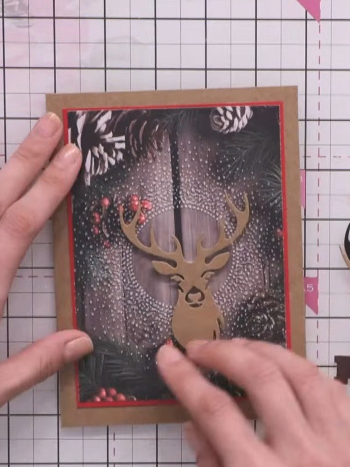Step 1: Cut the stag die from craft-coloured card stock. Position the die-cut stag on your card front to check placeme