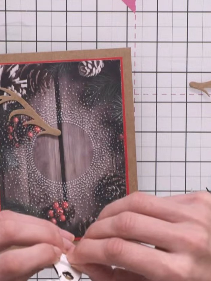 Step 5: Adhere the drop shadow stag die-cut to your card base. Position it centrally on the red-matted black panel wit