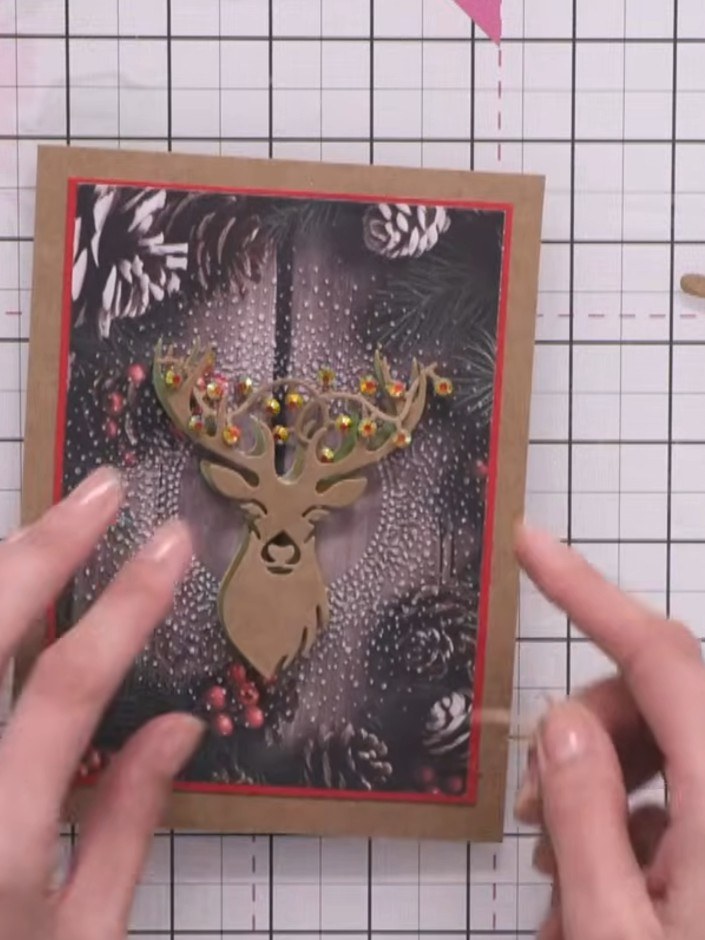 Step 6: Layer the craft-coloured stag die-cut on top of the drop shadow stag, ensuring it is centred and aligned prope