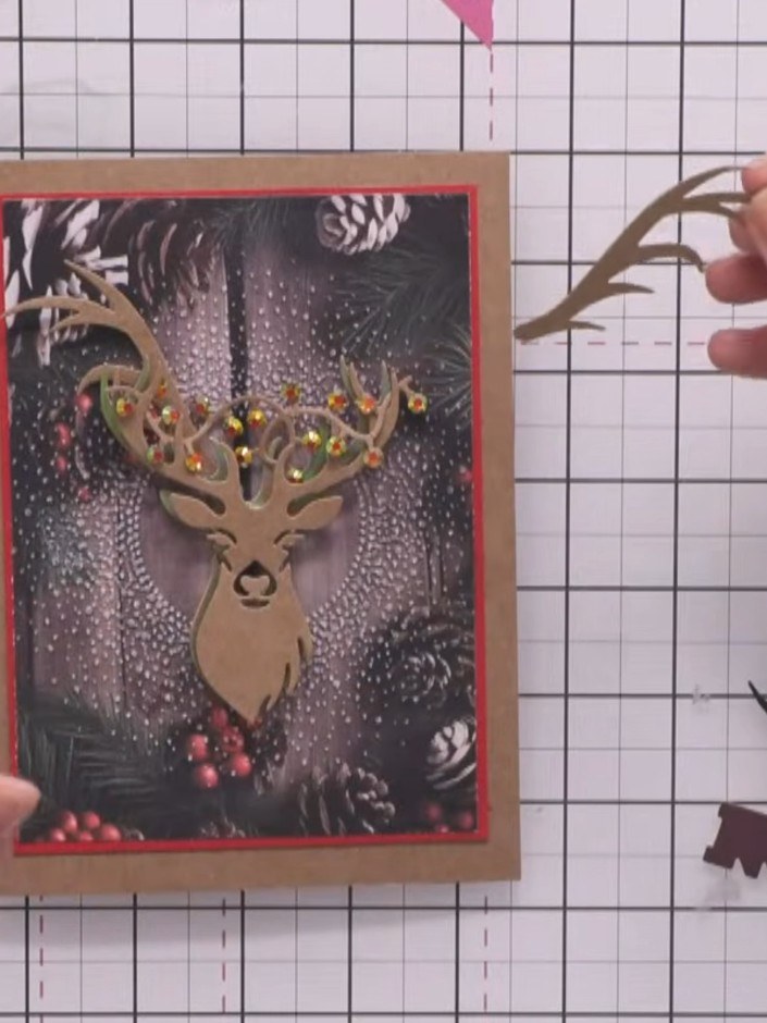 Step 7: Weave and thread the berries and lights piece through the antlers. Secure with small dots of glue where needed