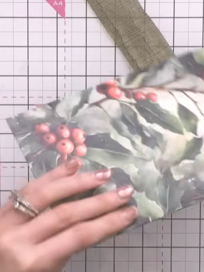 Step 4: Add die-cut holly and berry greenery around the flowers on your box. Distress the edges of the greenery pieces