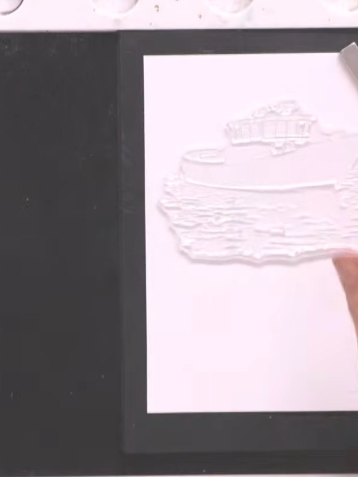 Step 1: Take the solid portion of the boat stamp and ink it randomly with Tiffany and ocean ink pads, applying the col