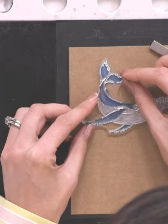 Step 7: Ink the solid wave stamp with white ink and stamp it onto the kraft card panel to create foam details on the w