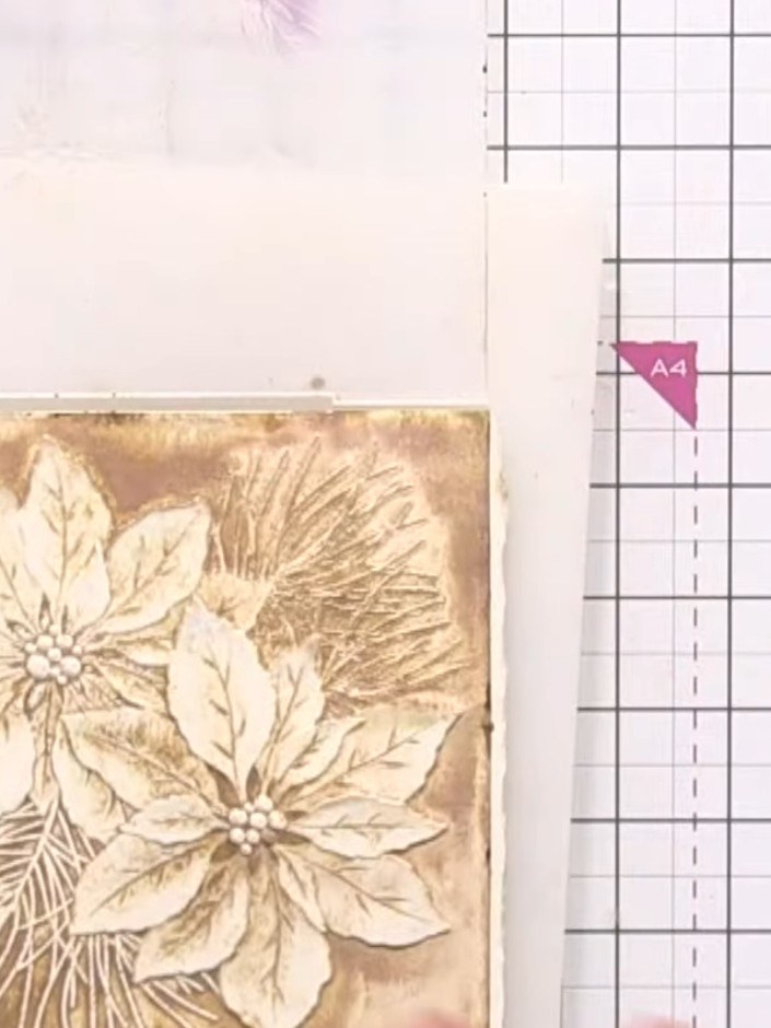 Step 9: Once the embossed panel is completely dry, lightly tap a white ink pad over the raised areas to push back the 