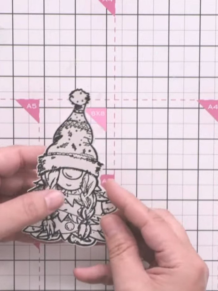 Step 1: Stamp the gnome character from the Gnome for the Holidays stamp set onto white watercolour card using black in