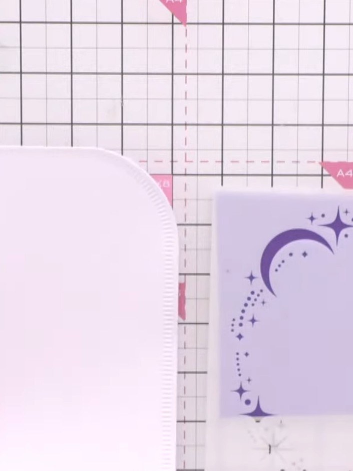 Step 1: Take a white card blank with a score line down the centre. Position a shaped die (such as a scalloped oval) to