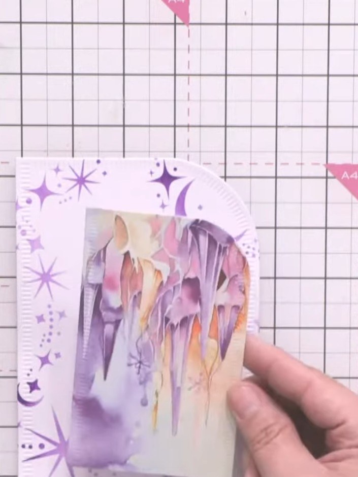 Step 8: Layer the decorative paper panel onto the card blank, positioning it with the hinge at the top. Use the papers