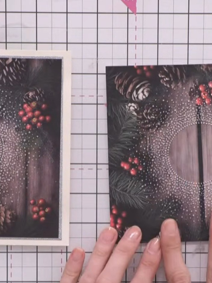 Step 1: Kurbel dein gemustertes Papier durch den Snow-Burst-Prägefolder. The paper features a festive wreath design w