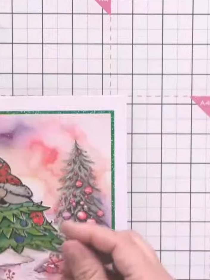 Step 7: Position the die-cut gnomes on your card. Place one gnome so it appears to be running in from the side of the 