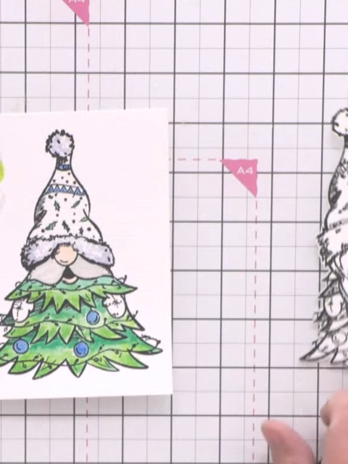 Step 2: Colour the gnome stamp using watercolours. Add colour to the face, clothing, and other details of the gnome im