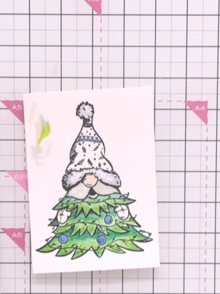 Step 3: Die cut the stamped gnome image using the coordinating die. The die will cut around the gnome and create inter