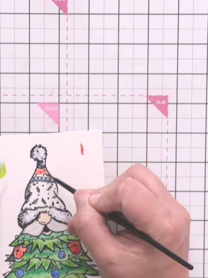 Step 5: Mount the completed coloured gnome topper onto your card base, positioning the gnome as the focal point of you