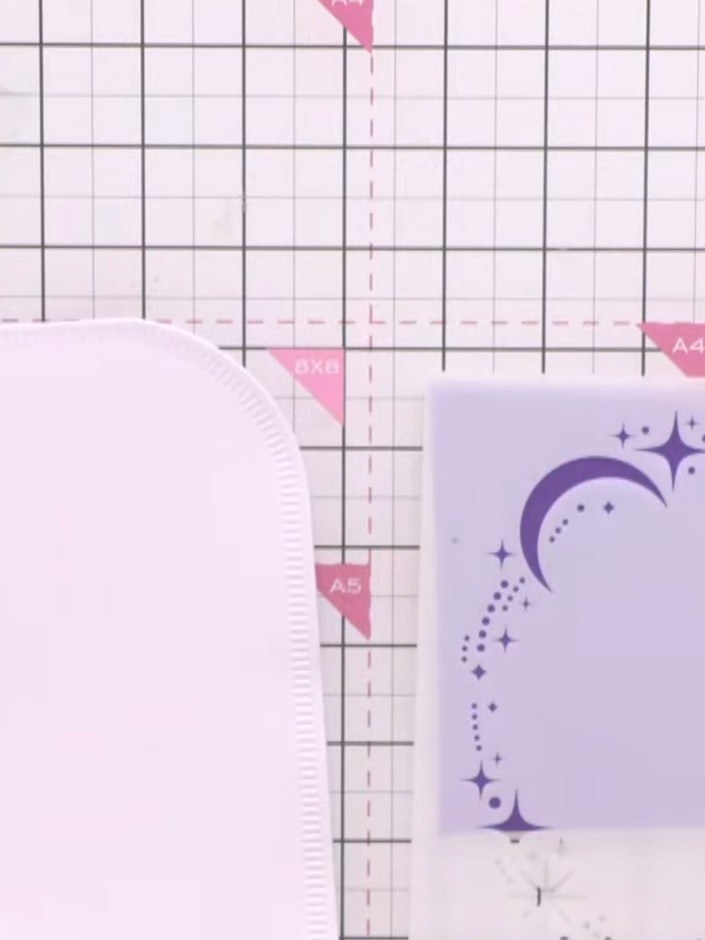 Step 2: Use a 7 by 7 inch stencil to apply sparkly paste around the edges of the shaped card, creating a decorative bo