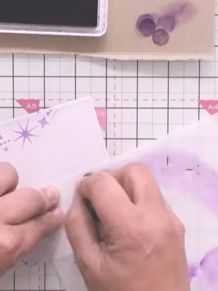 Step 6: Stamp the gnome characters onto white cardstock. Colour the stamped images using purple ink or markers to matc