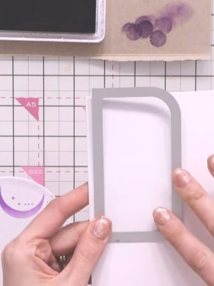Step 7: Die cut the gnome characters from the stamp and die set. Position the gnome on the front of your shaped card, 