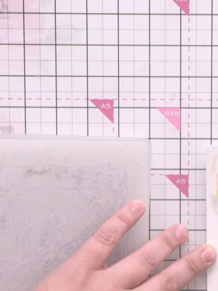 Step 6: Layer strips of patterned paper over glitter cardstock to create your background. Position the strips on your 