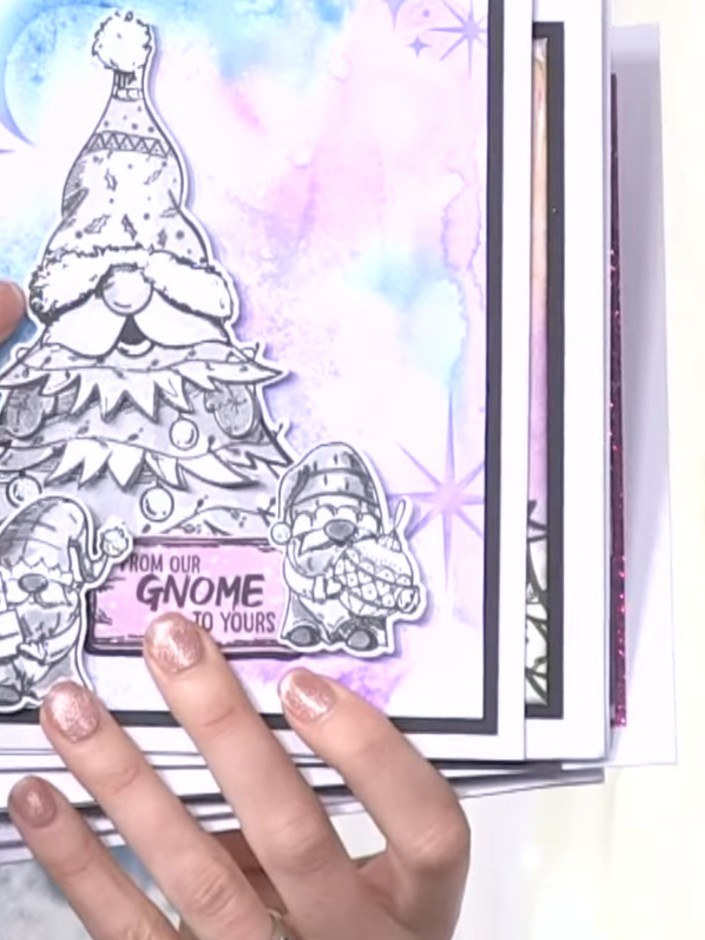 Step 3: Position the coordinating die over the stamped gnome and tree image, aligning it carefully to ensure the die m