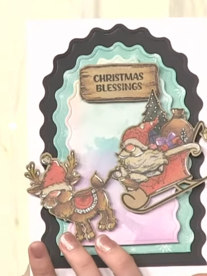 Step 7: Add a sentiment to complete your card. Choose a message such as 'Christmas Blessings' and attach it to the top
