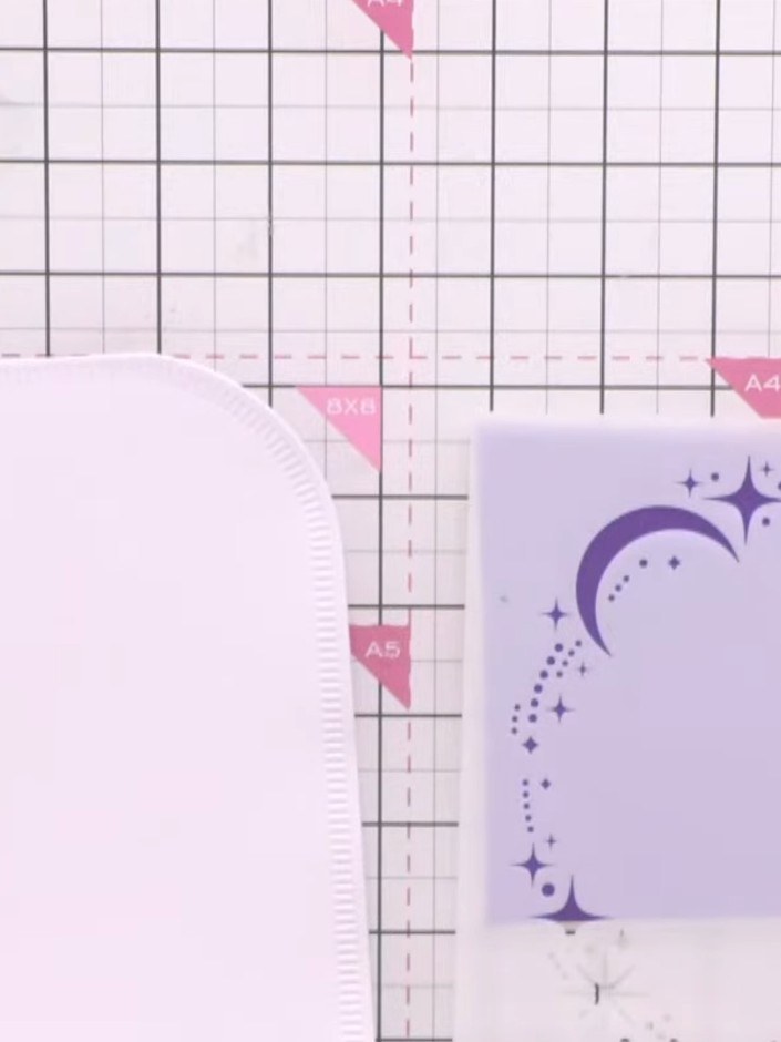 Step 1: Take a card blank with a score line and position a shaped die (such as a star or decorative edge) over the top