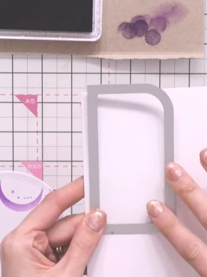Step 6: Position the stamped and coloured paper piece onto the card blank, allowing it to hang slightly over the top e