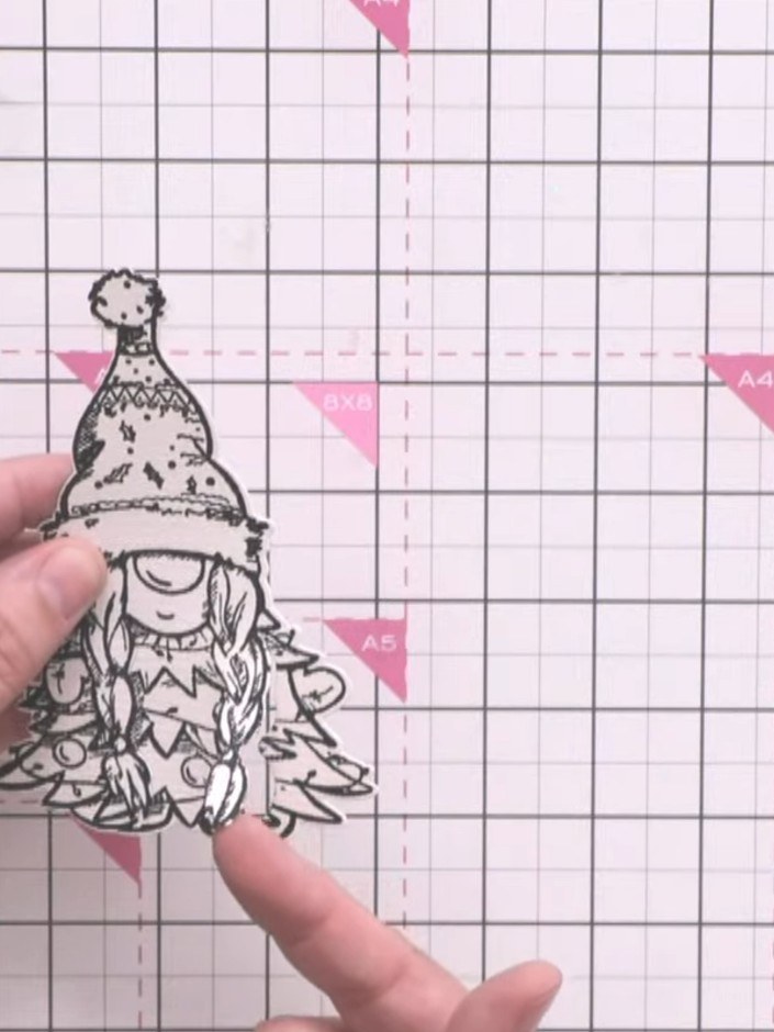 Step 1: Stamp the gnome character from the Gnome for the Holidays stamp set in black ink onto white watercolour card. 