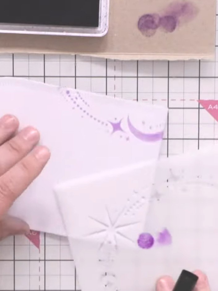 Step 3: Apply sparkly paste or glitter through the stencil onto the purple stencilled areas using a sponge applicator.