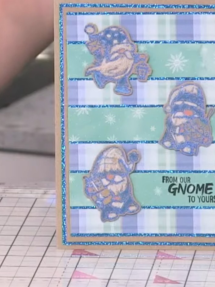 Step 10: Add a sentiment stamp or sticker to the bottom right of the card to complete your design. The example shown us