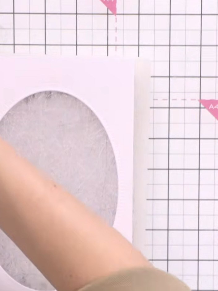 Step 1: Select the largest oval die from your die set. Cut it from pink cardstock to create the outer frame for your f