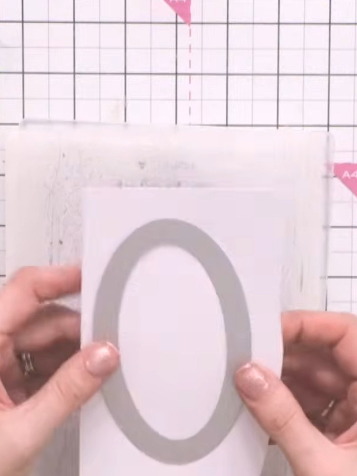 Step 3: Cut the third-size oval from the die set using acetate or vellum to create a transparent window effect. This w