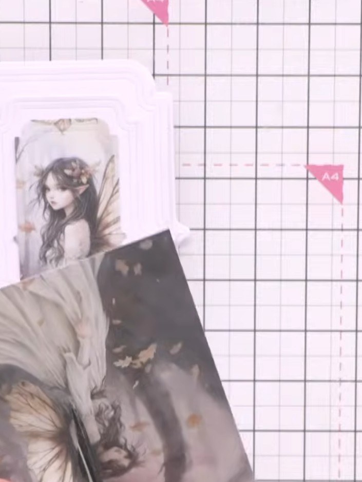 Step 9: Adhere the die-cut fairy wings to the back of the fairy image topper, positioning them so they extend outward 