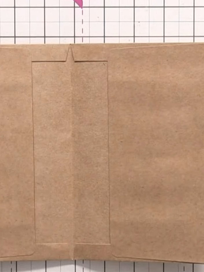 Step 1: Take two envelopes and apply glue to the flaps. Press the flaps together to create your first page, forming a 
