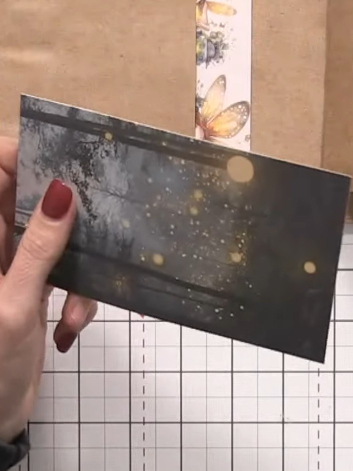 Step 10: Insert a decorative card or gift card into the top tab pocket, allowing it to extend above the edge of the alb