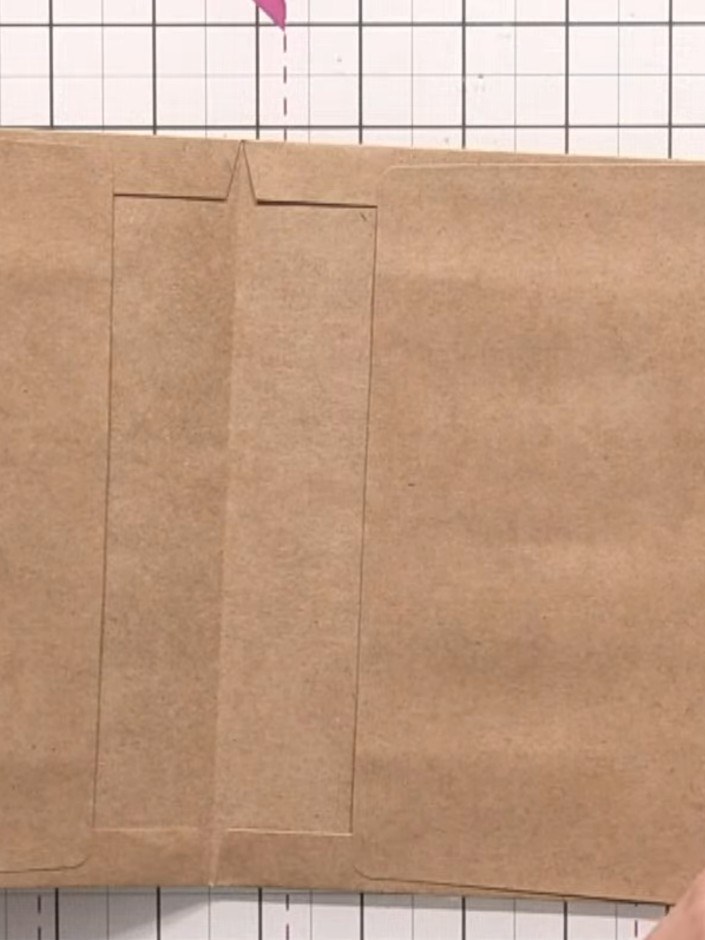 Step 2: Insert a second envelope inside the first envelope, aligning it with the scored lines. The second envelope sho