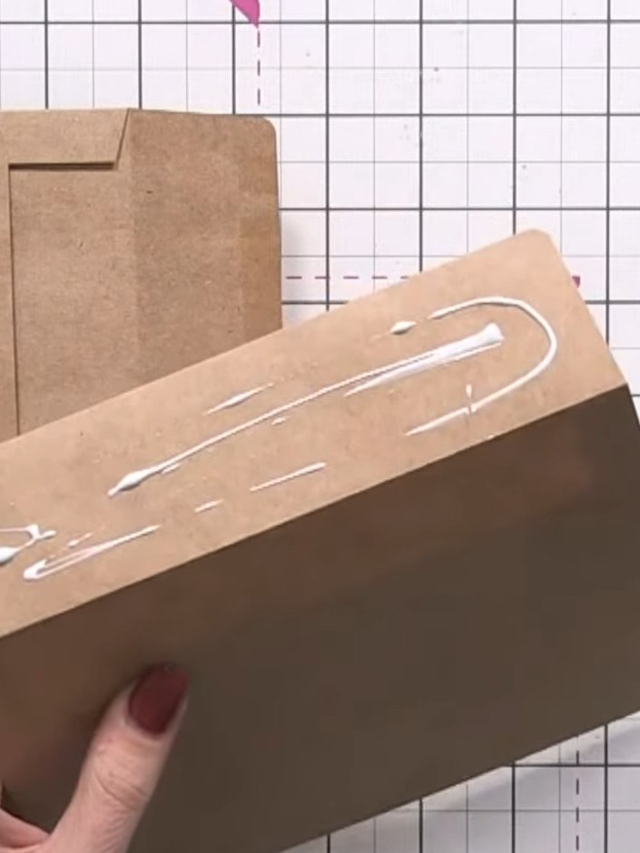 Step 3: Take a third envelope and seal it shut to create a pocket. Apply glue to the back of the sealed envelope and a