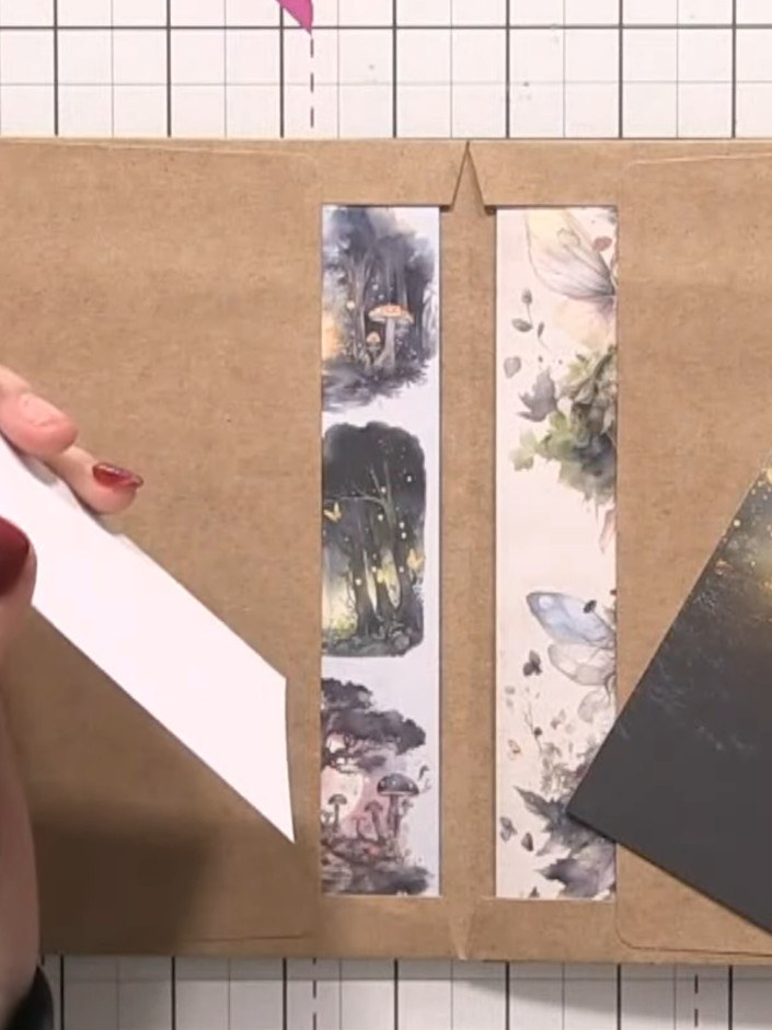 Step 7: Apply glue to the back of a belly band strip and position it horizontally across the card base, placing it nea