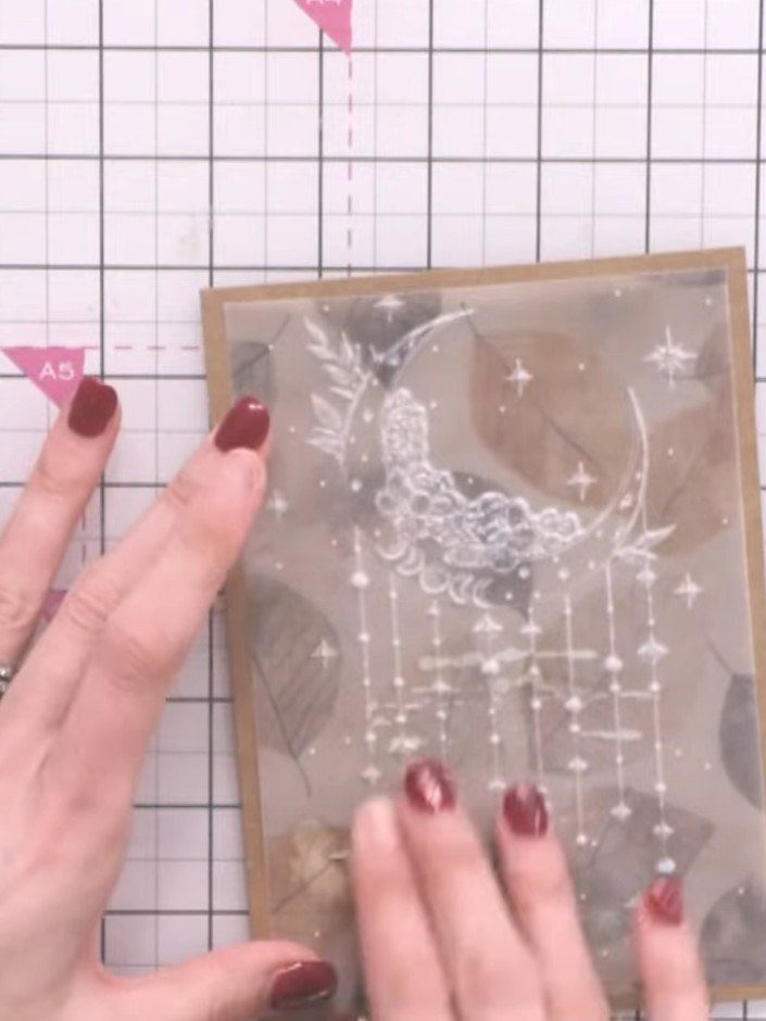 Step 6: Adhere the embossed vellum to the back of your kraft card base using glue only in areas where it will be hidde