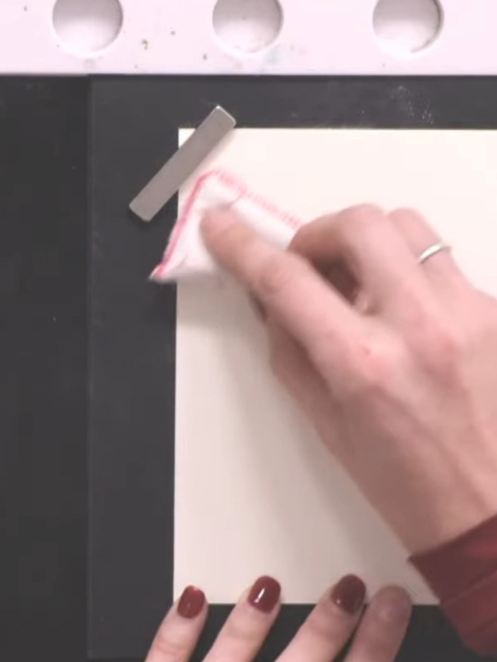 Step 4: Dust the stamped surface with white embossing powder, tapping away the excess. Heat set with a heat gun until 