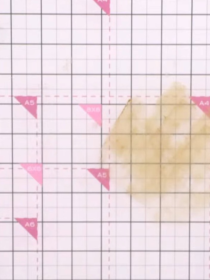 Step 6: Add blue Distress Oxide ink to another area of your craft mat. Drop the card into the ink again to layer addit