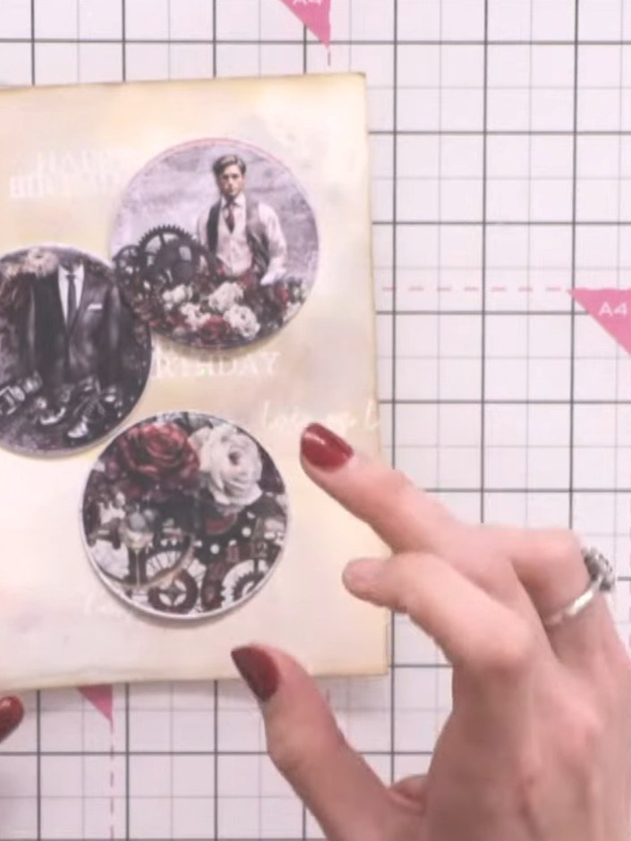 Step 9: Arrange three circular die-cut images on your inked cream card background, positioning them to create a pleasi