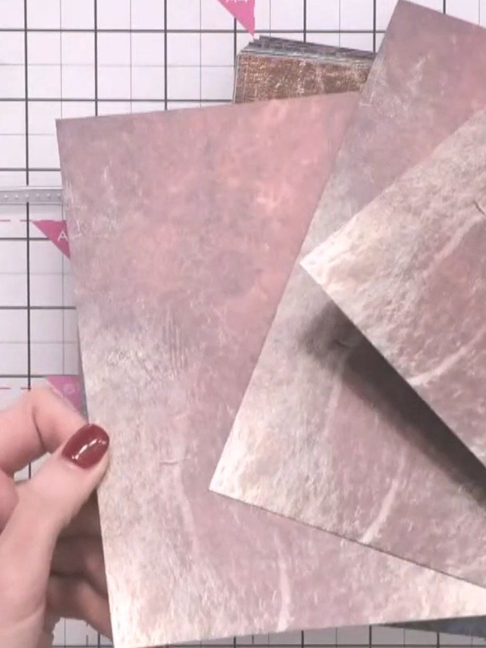 Step 1: Cut multiple wallet die shapes from your patterned paper. Ensure you cut on the white side so the pattern show