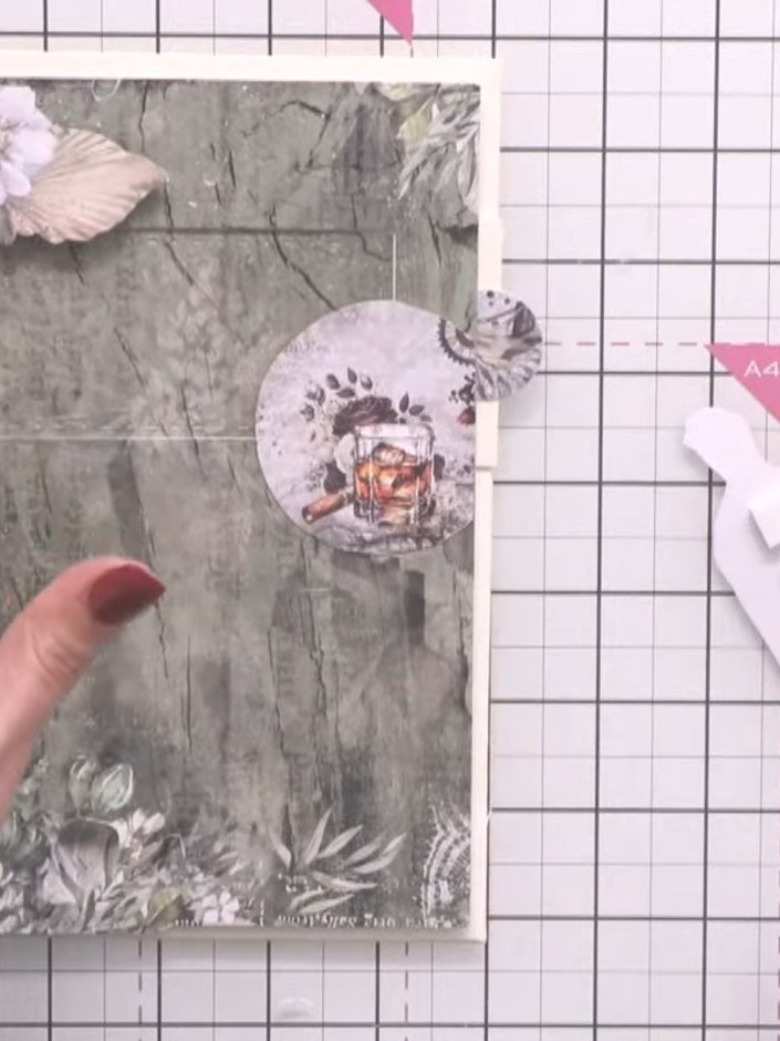Step 10: Fussy cut decorative elements from your paper pad and layer them around the card front using foam pads to add 