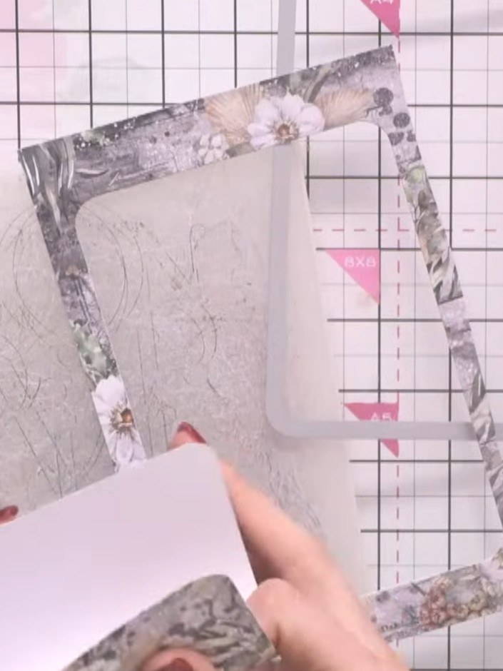 Step 3: Fold the exterior piece in half along the scored line to form the wallet shape. The decorative patterned paper