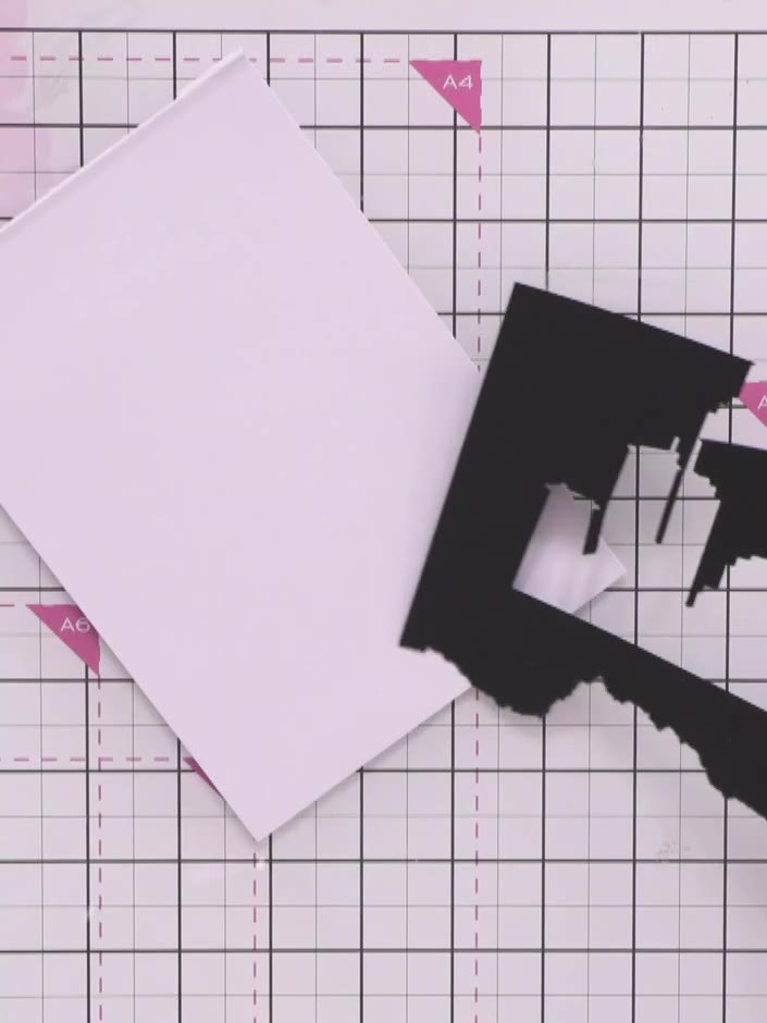 Step 5: Cut a second skyline die from black card stock. This will be layered behind the first skyline to create depth 