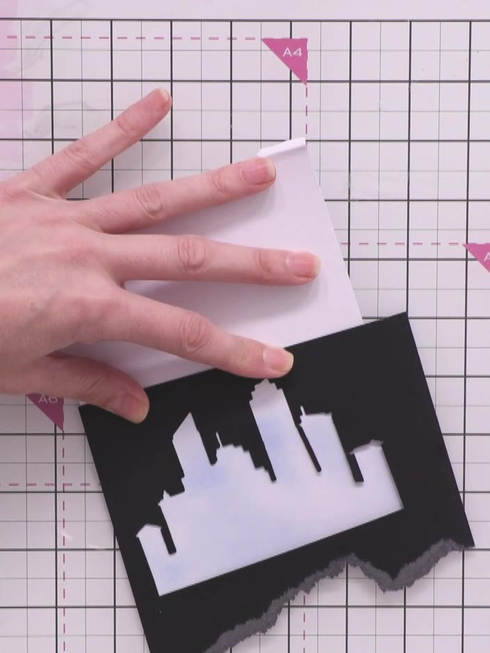 Step 6: Stamp the reflection, fireworks and sparkle details onto the white background panel using the cityscape stamp 