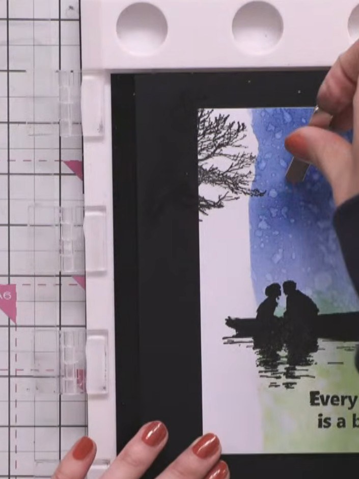 Step 12: Using a blending brush with black ink, add a subtle vignette around the edges of the card to frame the design 