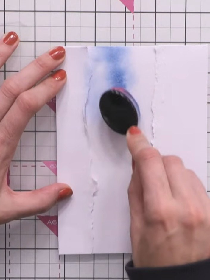Step 3: Blend blue ink onto the white card using a blending brush, working from the top downwards. Create a darker con