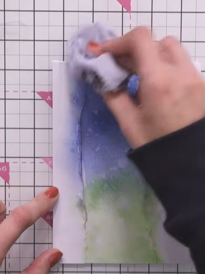 Step 6: Dab the wet inked panel with tissue to lift some of the colour and create a resist effect. This will add textu